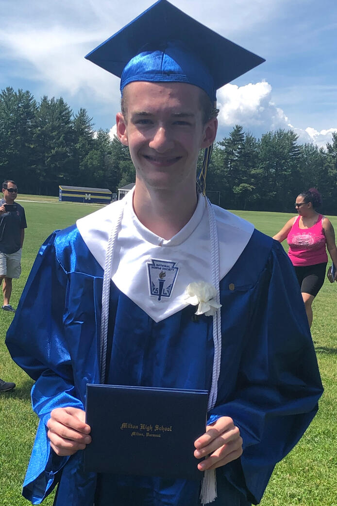 Me holding my High School Degree immediately after the Graduation Ceremony, 6/9/22
